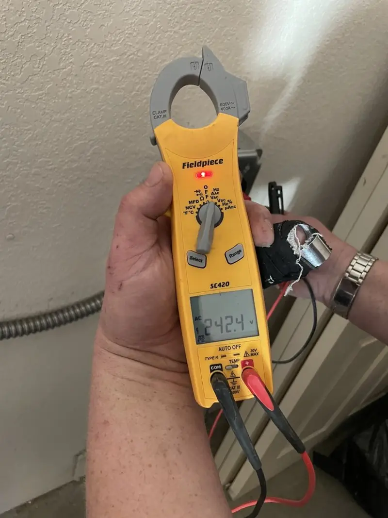 Voltage testing with clamp meter during Electrical Installation Services in Phillipsburg